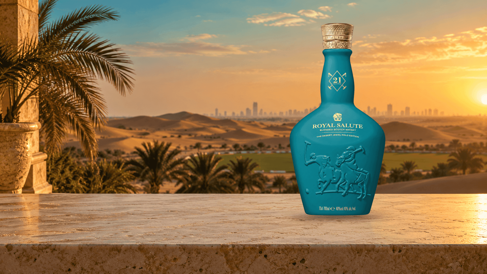 Royal Salute 21 Years Old Desert Jewel Polo Edition on a stone terrace above desert dunes at sunset